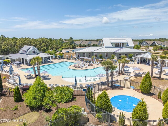 3032 Beachcomber Dr, Southport, NC 28461 - community pool featuring fence and a patio
