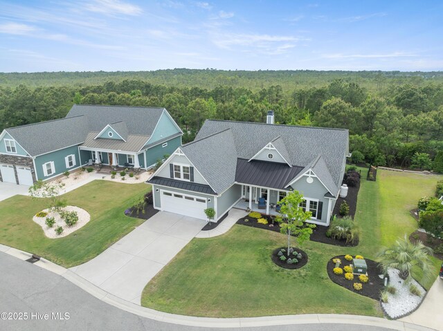 3032 Beachcomber Dr, Southport, NC 28461 - view from above of property featuring a heavily wooded area