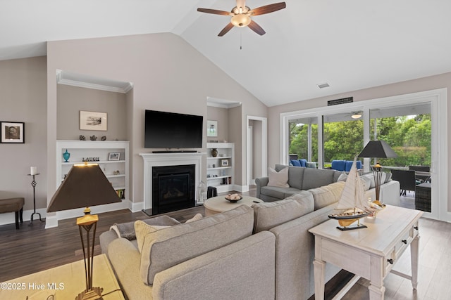 3032 Beachcomber Dr, Southport, NC 28461 - living area with a ceiling fan, wood finished floors, high vaulted ceiling, a glass covered fireplace, and baseboards