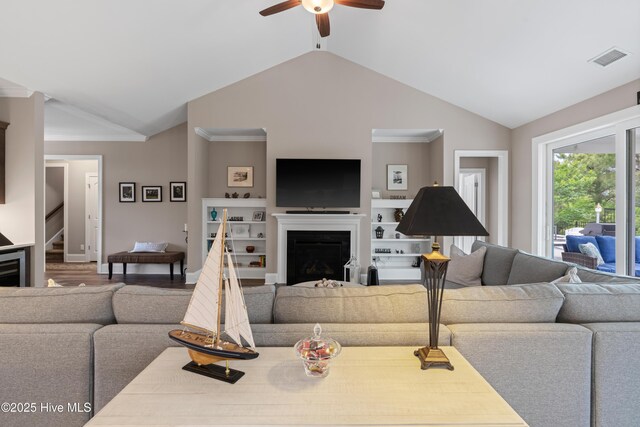 3032 Beachcomber Dr, Southport, NC 28461 - living area with a fireplace, lofted ceiling, a ceiling fan, stairway, and wood finished floors