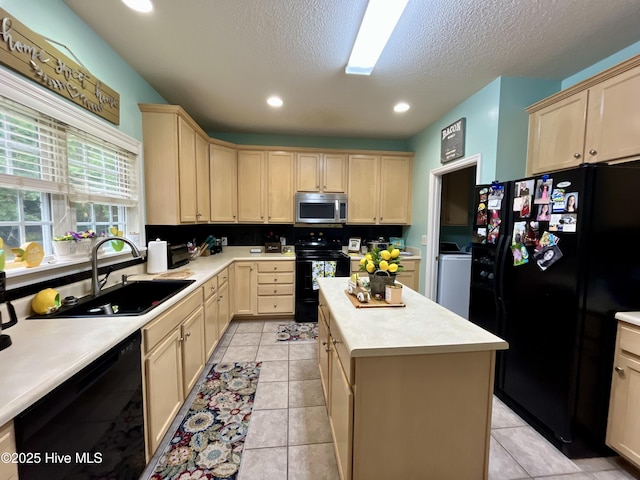 kitchen with black appliances, a sink, light brown cabinetry, light countertops, and recessed lighting