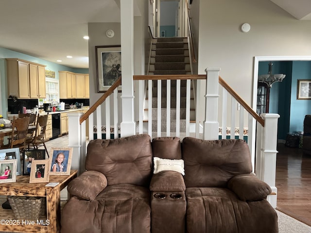 living room with light wood-style floors, stairs, and recessed lighting