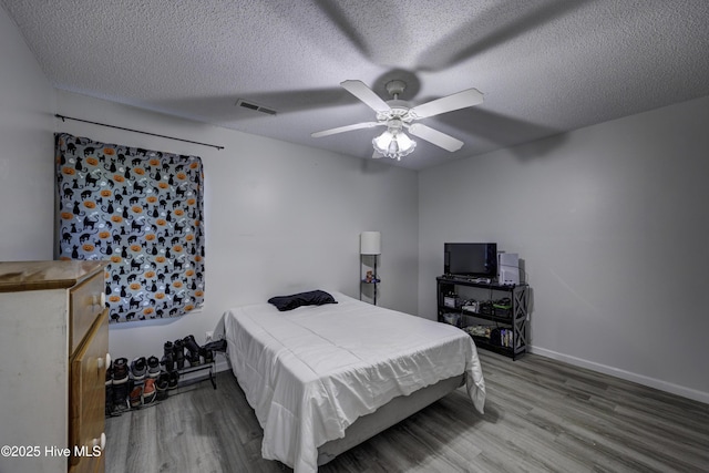 2726 S 17th St Unit C, Wilmington, NC 28412 - bedroom featuring wood finished floors, ceiling fan, a textured ceiling, and baseboards