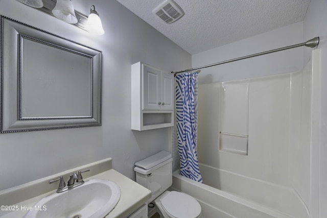 2726 S 17th St Unit C, Wilmington, NC 28412 - bathroom with a textured ceiling, vanity, shower / tub combo, and toilet