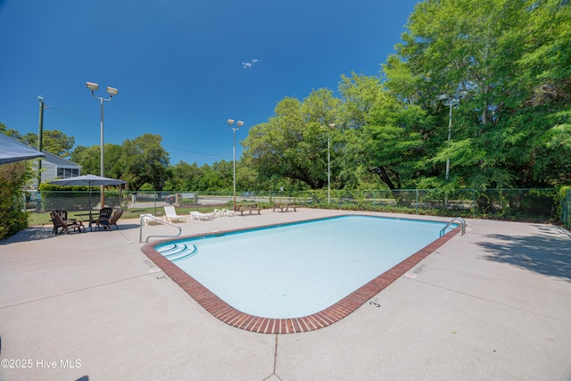 2726 S 17th St Unit C, Wilmington, NC 28412 - community pool featuring a patio area and view of wooded area
