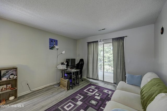 2726 S 17th St Unit C, Wilmington, NC 28412 - office area featuring wood finished floors, a textured ceiling, and baseboards