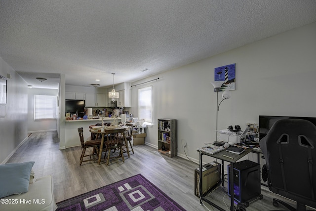 2726 S 17th St Unit C, Wilmington, NC 28412 - dining room featuring light wood-style flooring, a textured ceiling, and baseboards