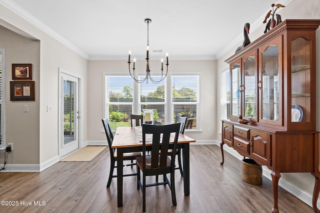 113 Eagle Claw Dr, Calabash, NC 28467 - dining space with a chandelier, dark wood finished floors, baseboards, and ornamental molding