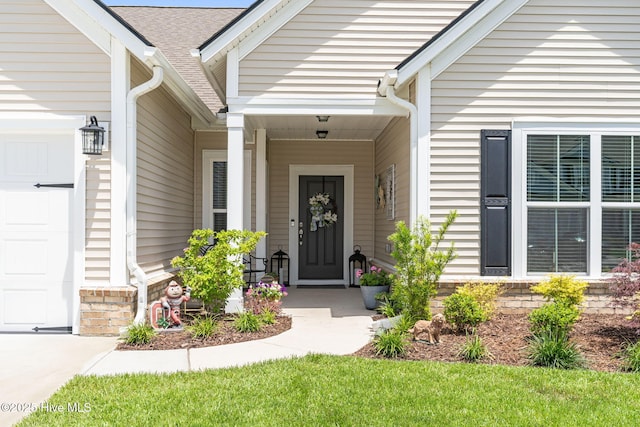 113 Eagle Claw Dr, Calabash, NC 28467 - property entrance featuring an attached garage and a porch