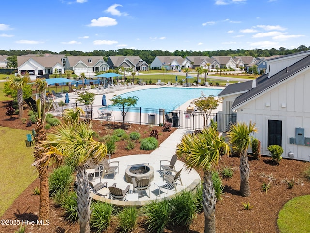 113 Eagle Claw Dr, Calabash, NC 28467 - community pool featuring an outdoor fire pit, a residential view, and a patio area