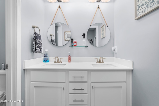 bathroom featuring double vanity