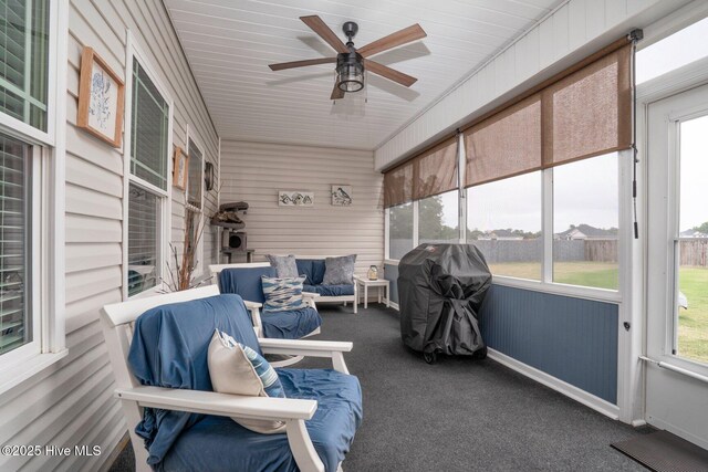 sunroom featuring an outdoor living space and ceiling fan