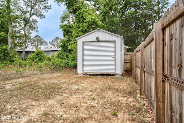 view of shed with fence