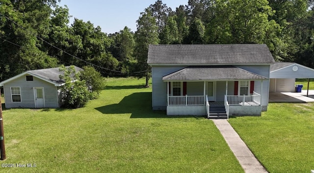 bungalow-style house featuring covered porch, a carport, a front yard, and roof with shingles