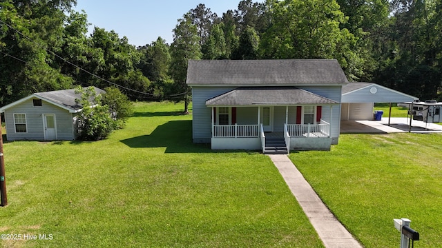 bungalow-style house with a porch, a carport, roof with shingles, and a front lawn