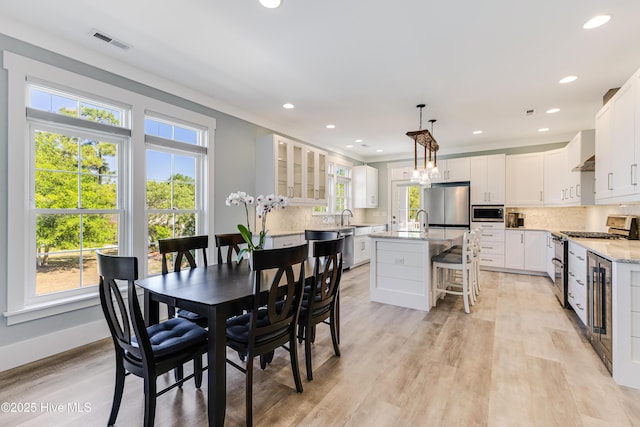 201 W Yacht Dr, Oak Island, NC 28465 - dining space featuring light wood-type flooring, recessed lighting, and baseboards