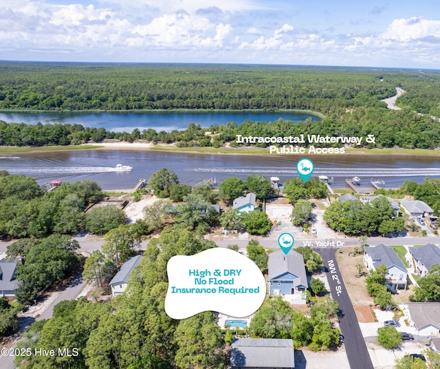 201 W Yacht Dr, Oak Island, NC 28465 - drone / aerial view of a forest and a nearby body of water