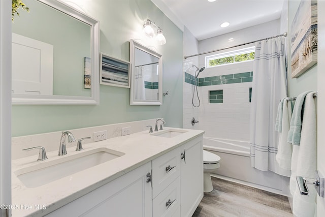 201 W Yacht Dr, Oak Island, NC 28465 - full bath with wood finished floors, shower / bath combo, toilet, double vanity, and recessed lighting