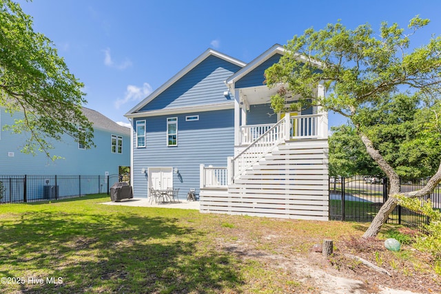 201 W Yacht Dr, Oak Island, NC 28465 - back of house featuring stairway and a patio