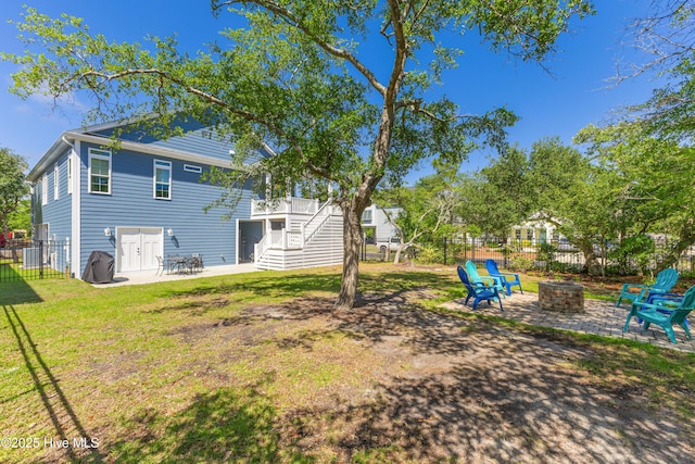 201 W Yacht Dr, Oak Island, NC 28465 - view of yard with a fire pit, a patio, and stairs