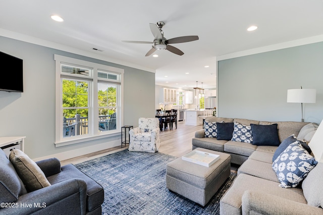 201 W Yacht Dr, Oak Island, NC 28465 - living area featuring recessed lighting, ceiling fan, light wood-style floors, and a chandelier