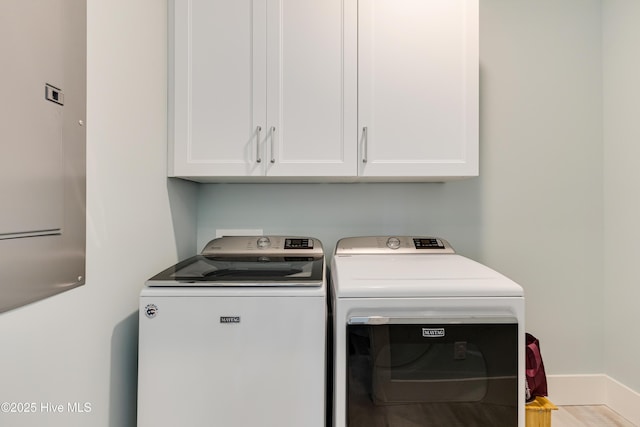 201 W Yacht Dr, Oak Island, NC 28465 - washroom with washer and clothes dryer, cabinet space, and baseboards