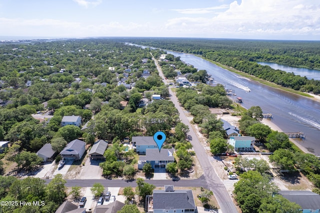 201 W Yacht Dr, Oak Island, NC 28465 - bird's eye view of a large body of water and a heavily wooded area