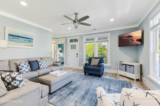 201 W Yacht Dr, Oak Island, NC 28465 - living area featuring ceiling fan, plenty of natural light, recessed lighting, ornamental molding, and light wood-type flooring