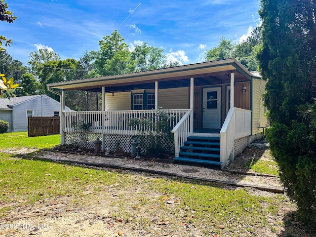 178 Stanley St, West End, NC 27376 - view of front of property featuring covered porch and a front lawn