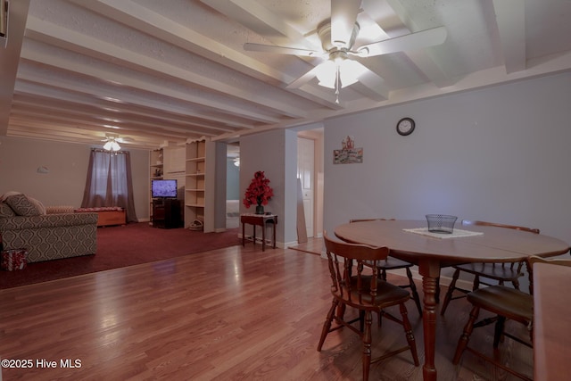 178 Stanley St, West End, NC 27376 - dining space featuring a ceiling fan, beamed ceiling, and light wood-style floors