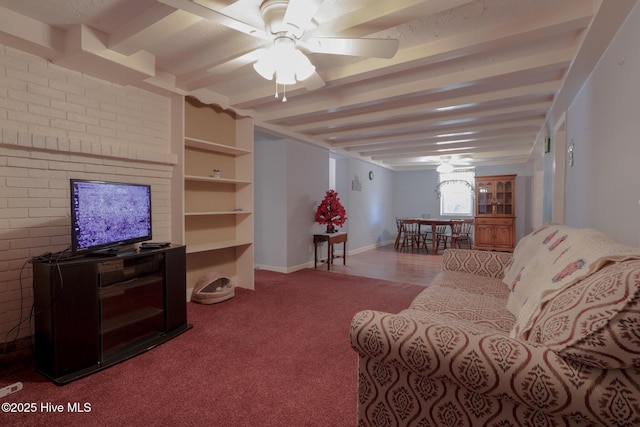 178 Stanley St, West End, NC 27376 - living room featuring carpet floors, ceiling fan, beam ceiling, and baseboards