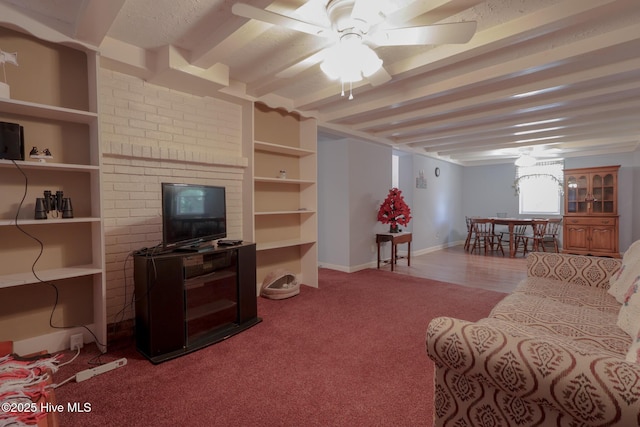 178 Stanley St, West End, NC 27376 - living room with carpet floors, ceiling fan, beamed ceiling, and baseboards
