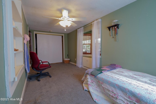 178 Stanley St, West End, NC 27376 - bedroom with a closet, carpet floors, baseboards, and ceiling fan
