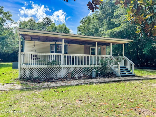 178 Stanley St, West End, NC 27376 - view of front of house featuring a porch and a front lawn
