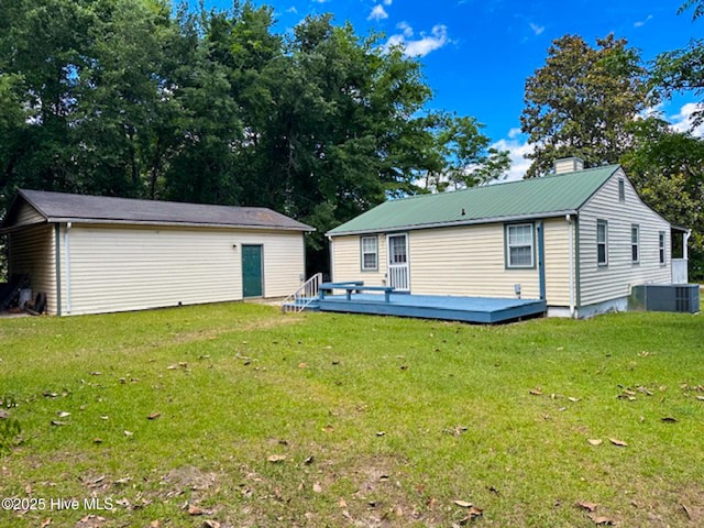 178 Stanley St, West End, NC 27376 - rear view of house with a deck, an outdoor structure, a yard, and central AC unit