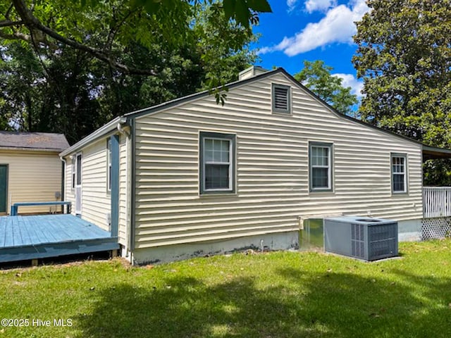 178 Stanley St, West End, NC 27376 - view of home's exterior featuring central AC, a wooden deck, and a yard