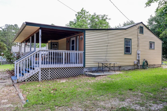 178 Stanley St, West End, NC 27376 - view of front of house featuring a porch and a front yard