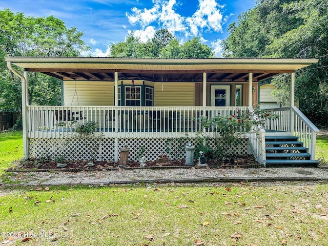 178 Stanley St, West End, NC 27376 - view of front of house featuring covered porch and a front yard