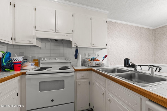 kitchen with white range with electric stovetop, under cabinet range hood, a sink, crown molding, and white cabinets