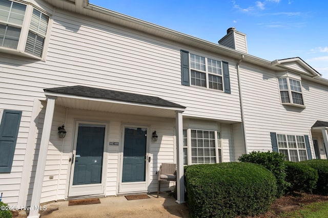view of front of home with a chimney