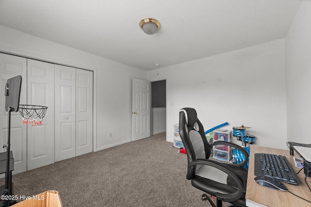 carpeted office featuring baseboards