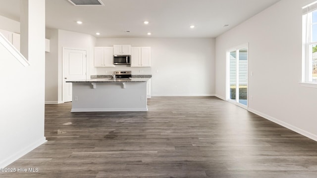 2304 Emerald Ave Lot 272, Castle Hayne, NC 28429 - kitchen with stainless steel appliances, white cabinetry, recessed lighting, open floor plan, and a center island with sink