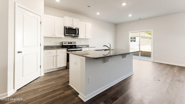 2304 Emerald Ave Lot 272, Castle Hayne, NC 28429 - kitchen featuring stainless steel appliances, a sink, dark wood finished floors, dark stone counters, and recessed lighting