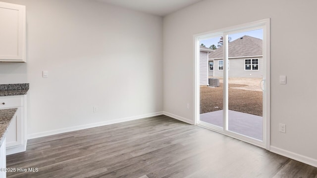 2304 Emerald Ave Lot 272, Castle Hayne, NC 28429 - unfurnished dining area with wood finished floors and baseboards