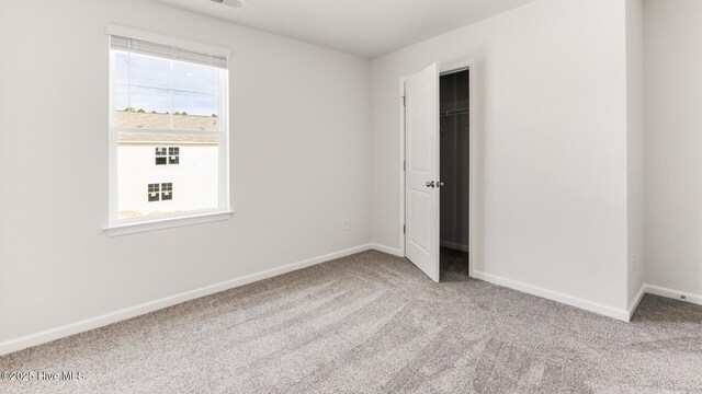 2304 Emerald Ave Lot 272, Castle Hayne, NC 28429 - unfurnished bedroom featuring carpet flooring, baseboards, and a spacious closet
