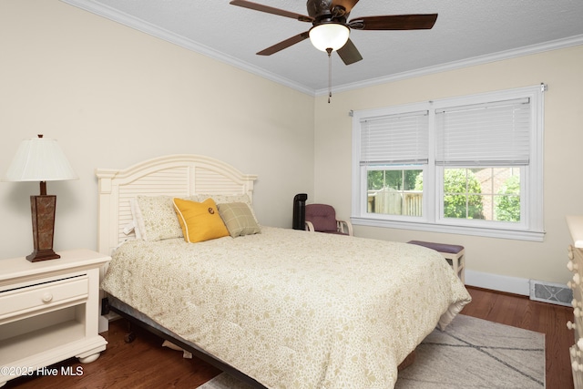 2008 S Elm St, Greenville, NC 27858 - bedroom with ornamental molding, dark wood-style floors, baseboards, and a ceiling fan