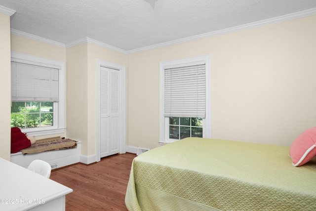 2008 S Elm St, Greenville, NC 27858 - bedroom with wood finished floors, ornamental molding, a textured ceiling, and baseboards