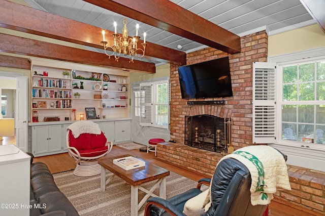 2008 S Elm St, Greenville, NC 27858 - living area with light wood-style flooring, beamed ceiling, a chandelier, and a fireplace