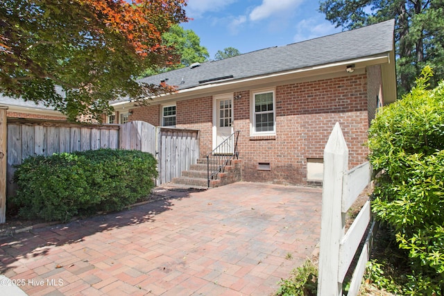 2008 S Elm St, Greenville, NC 27858 - back of house featuring brick siding, a patio, roof with shingles, and crawl space