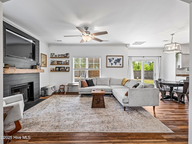 118 Prospect Dr, Richlands, NC 28574 - living room with ornamental molding, dark wood-style floors, a ceiling fan, and a fireplace